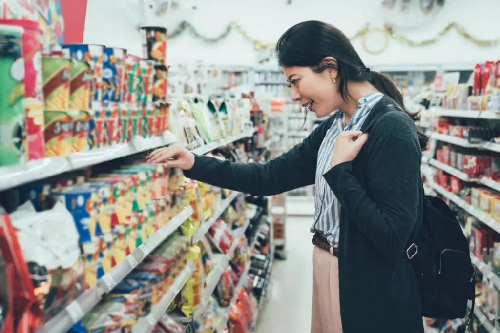 woman choosing products in convenience