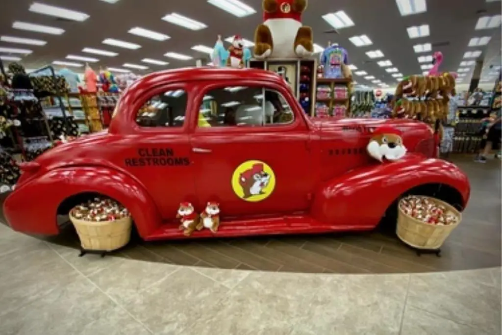 Buc-ee's retail products on display in a red antique car