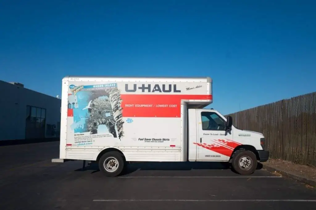 uHaul moving truck parked in an otherwise empty parking lot